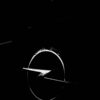 a black and white photo of a steering wheel