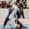 shallow focus photo of two man playing taekwondo