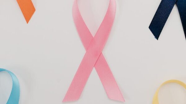 A flatlay of various colored ribbons symbolizing different health awareness campaigns.