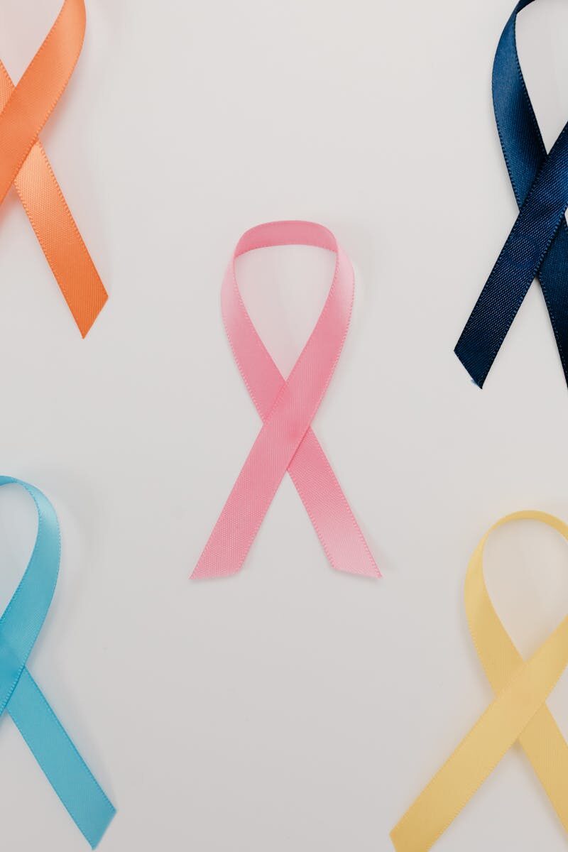 A flatlay of various colored ribbons symbolizing different health awareness campaigns.