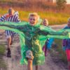 boy in green and blue jacket