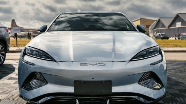 A silver sports car parked in a parking lot