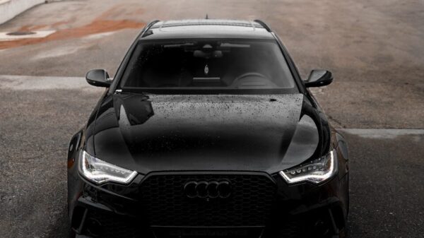 black bmw m 3 parked on parking lot during daytime
