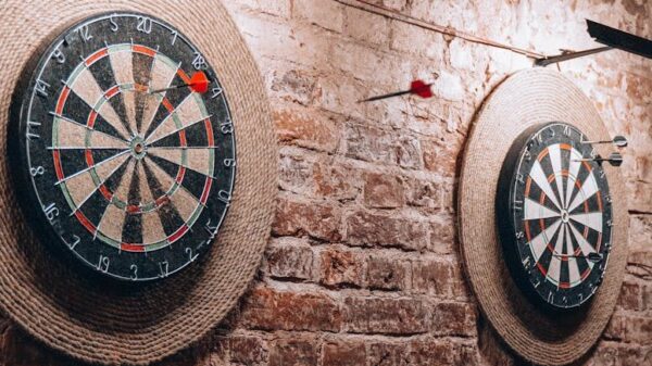 Two dartboards on a vintage brick wall create a retro vibe inside a Belarus café.