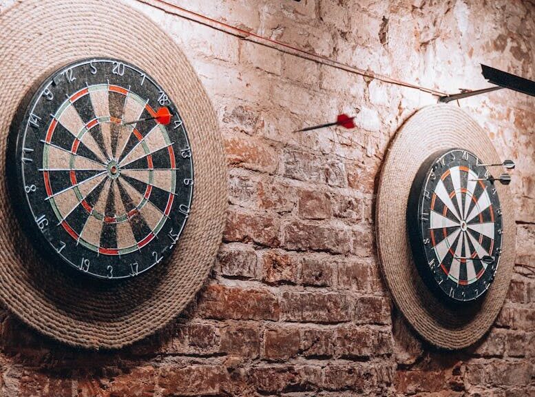 Two dartboards on a vintage brick wall create a retro vibe inside a Belarus café.