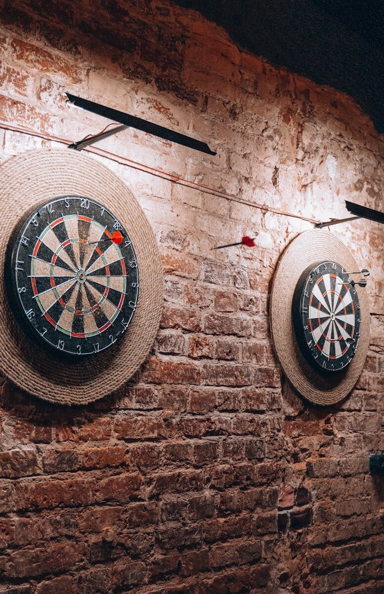 Two dartboards on a vintage brick wall create a retro vibe inside a Belarus café.