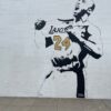 a mural of a man holding a baseball bat