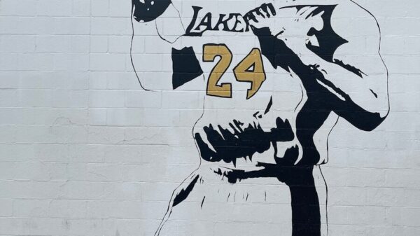 a mural of a man holding a baseball bat