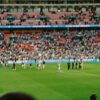 Crowd watching a sports game in a stadium