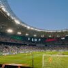 A thrilling football match with packed stands at FC Krasnodar's iconic stadium.