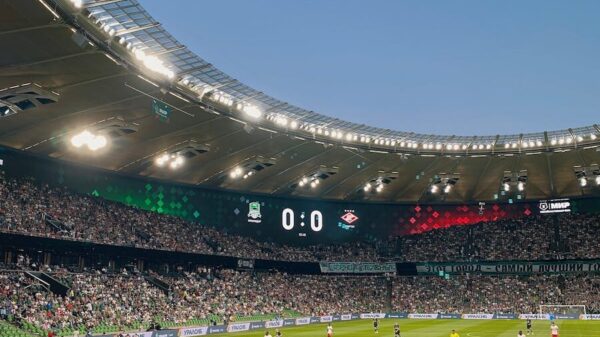 A thrilling football match with packed stands at FC Krasnodar's iconic stadium.