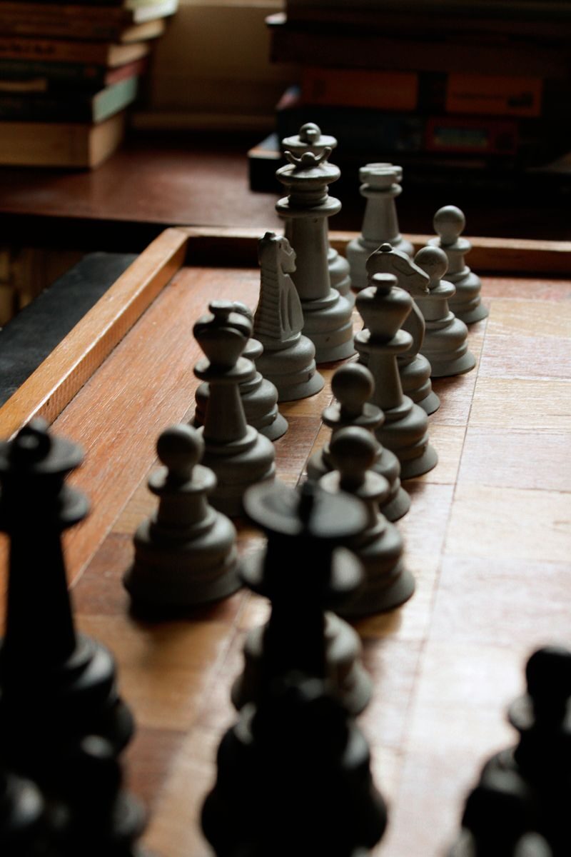Close-up image of a chessboard with arranged pieces highlighting the game's strategy.