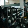 Well-equipped indoor gym featuring kettlebells, weights, and workout gear, perfect for fitness enthusiasts.