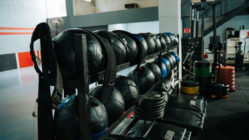 Well-equipped indoor gym featuring kettlebells, weights, and workout gear, perfect for fitness enthusiasts.