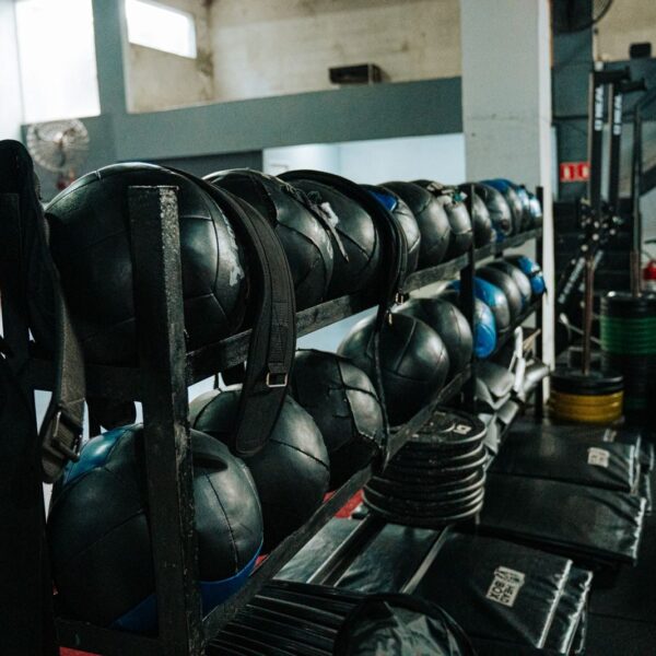 Well-equipped indoor gym featuring kettlebells, weights, and workout gear, perfect for fitness enthusiasts.