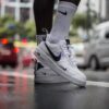 nike, air force, manilla, street shoot, shoes, nature, wet street, fashion, clothing, sneakers, puddle, sports, rain, wet, street, footwear, water, gray water, gray rain, gray fashion, gray clothes, gray street, gray sports, gray shoes