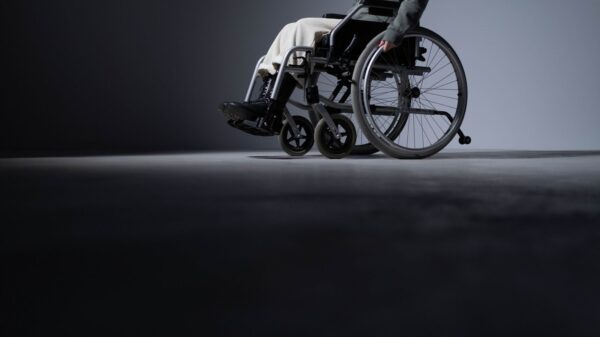 Studio shot of a person in a wheelchair with ample copy space, highlighting accessibility.